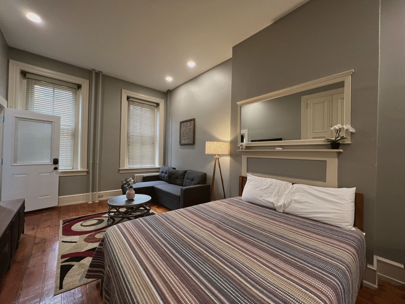 Shared room with hardwood floors and natural light